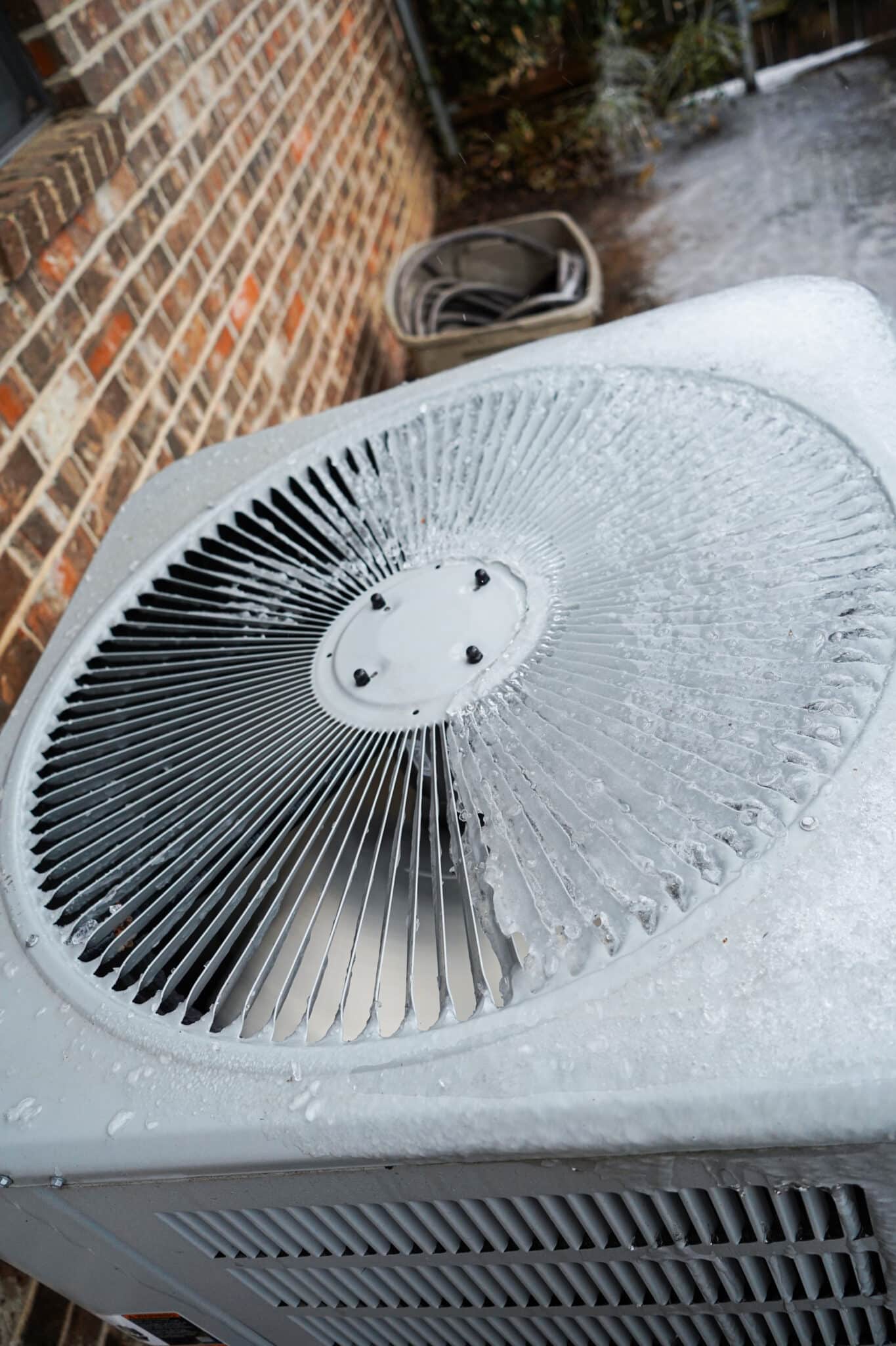 Heating/AC condenser outside at a Texas residence during a freeze, Outdoor HVAC Units.